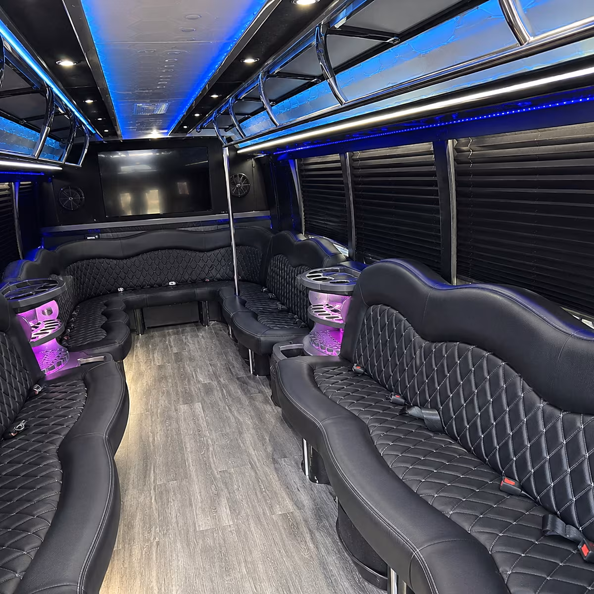 Friends laughing during a party bus celebration in Wilmington